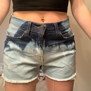 Cut and bleached denim shorts